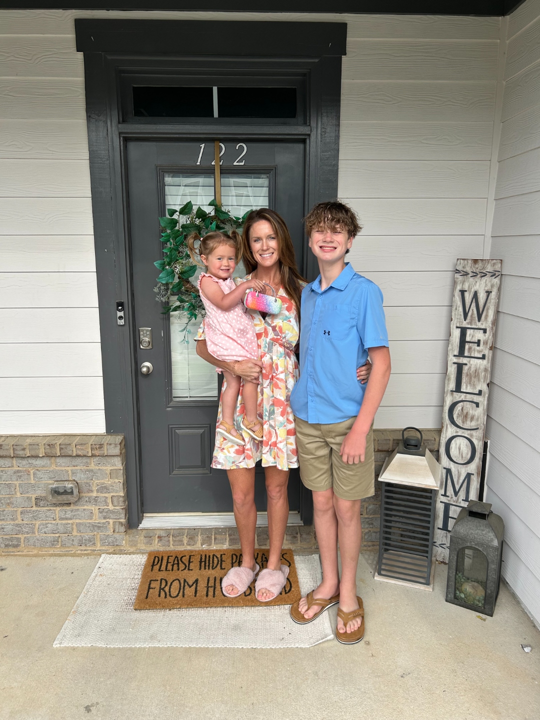 Andrea, Jackson, and Abby at their front door