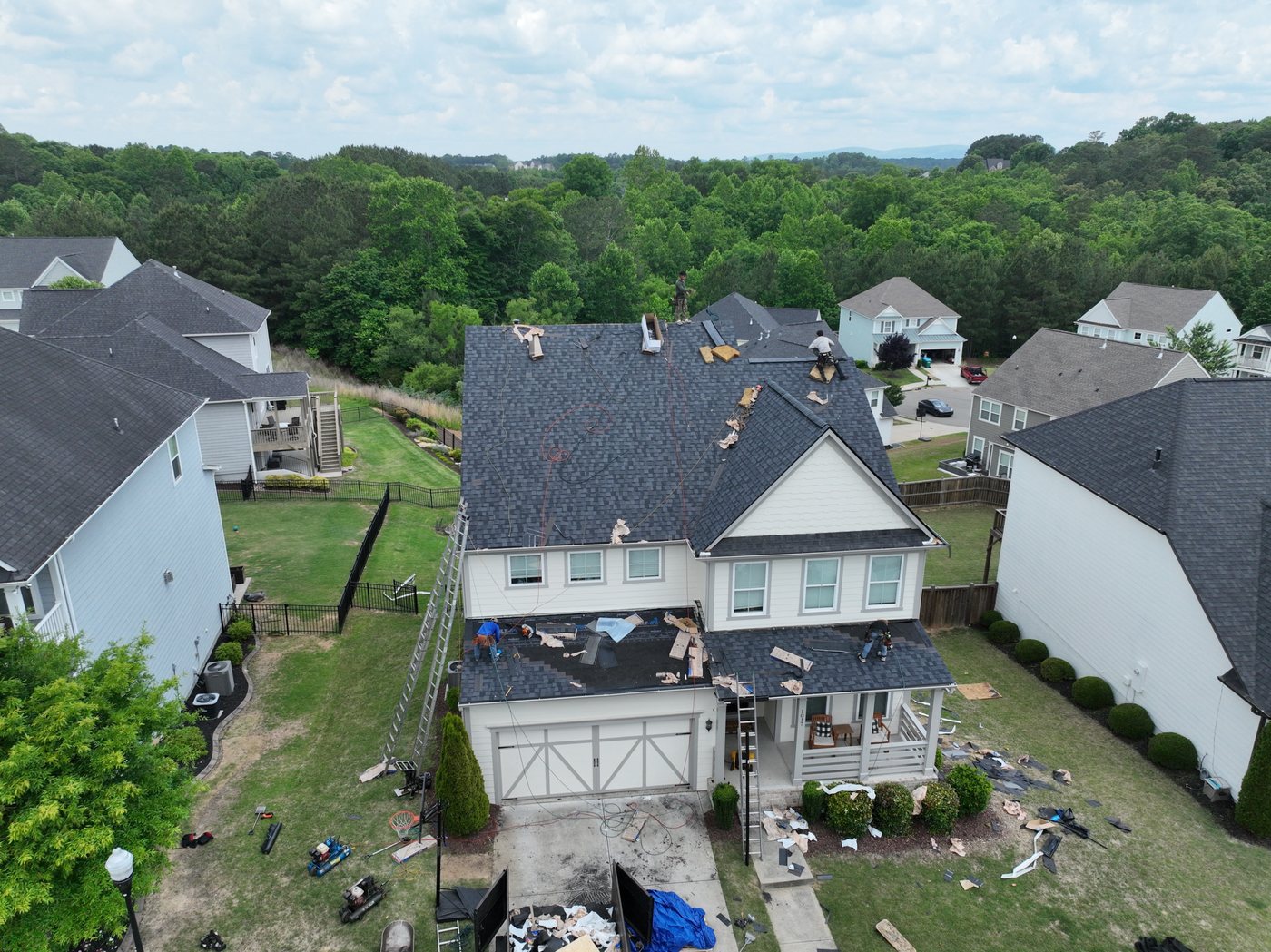 Crew installing shingles on a Canton home, photographed by drone