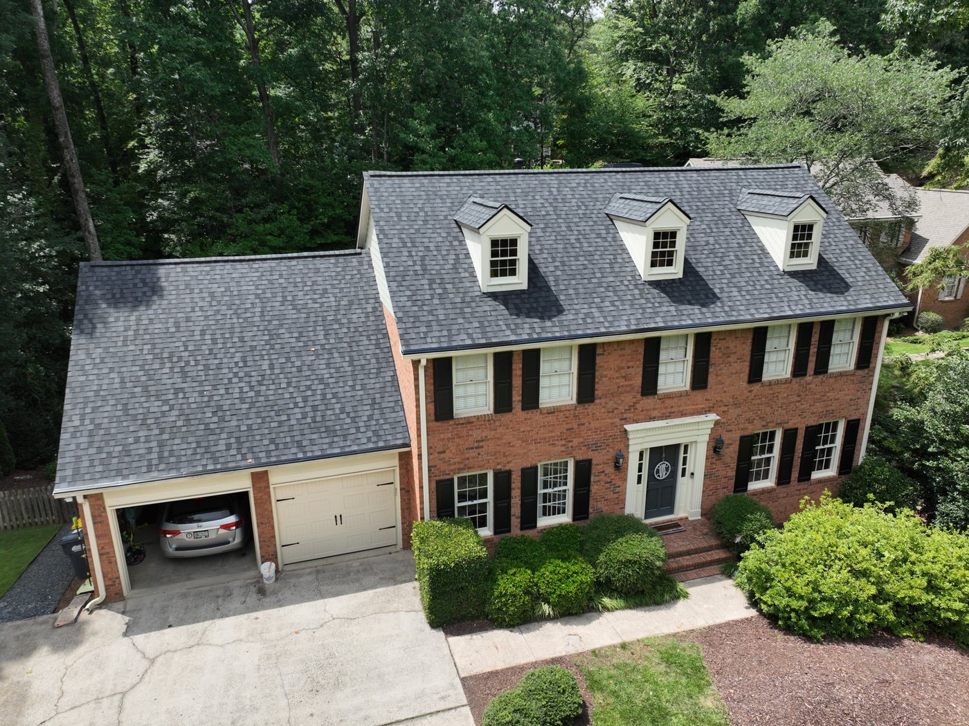 Completed Marietta roof with the full front roofline and dormers visible