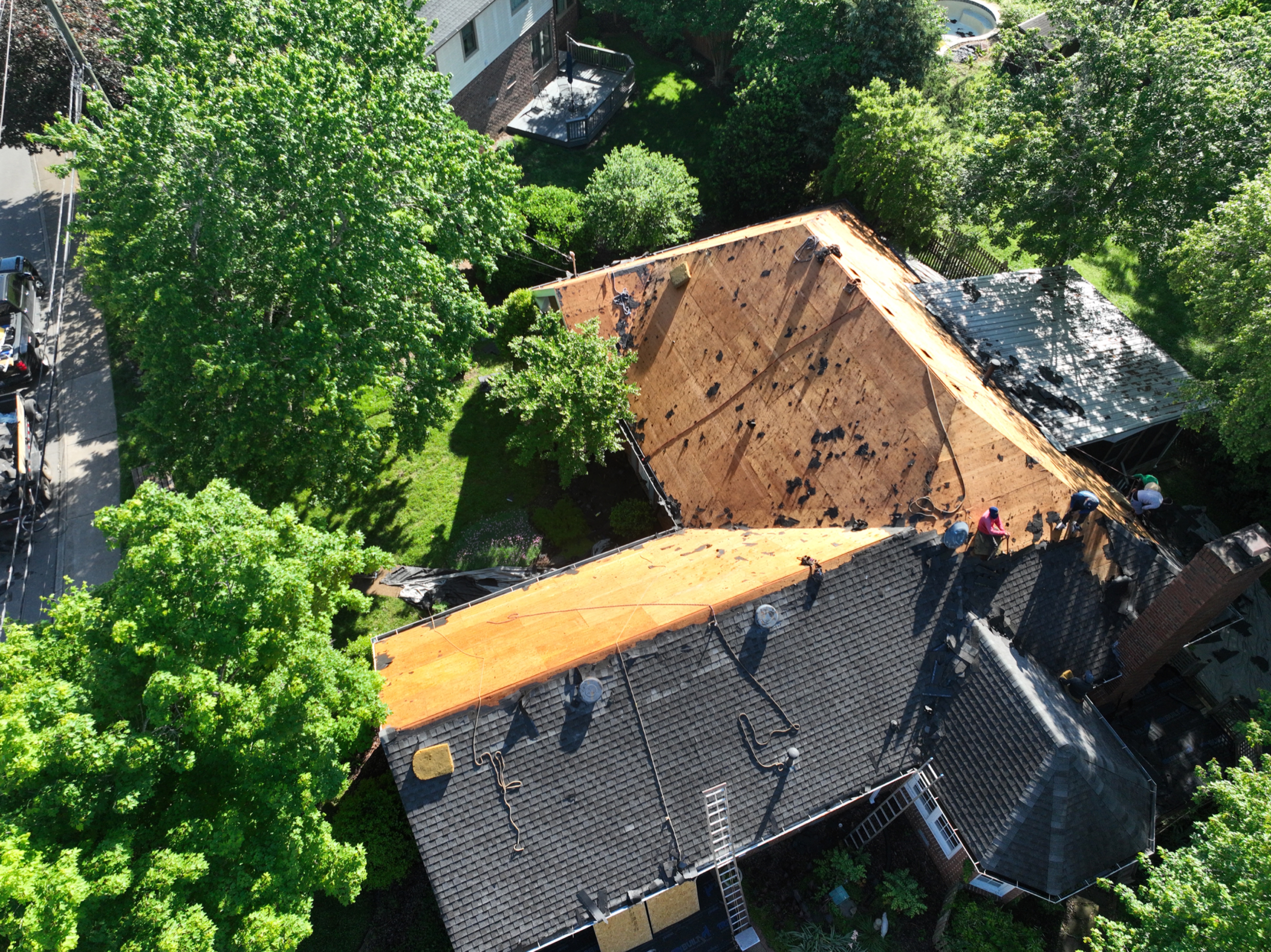 Real drone photo documenting a roof replacement tear-off in progress by Build From Above Roofing