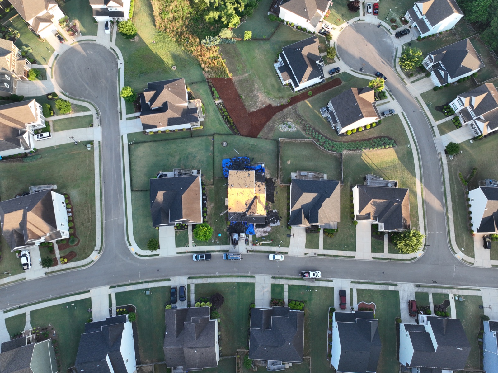 Drone view of roof decking and replacement progress on a Canton GA roofing project